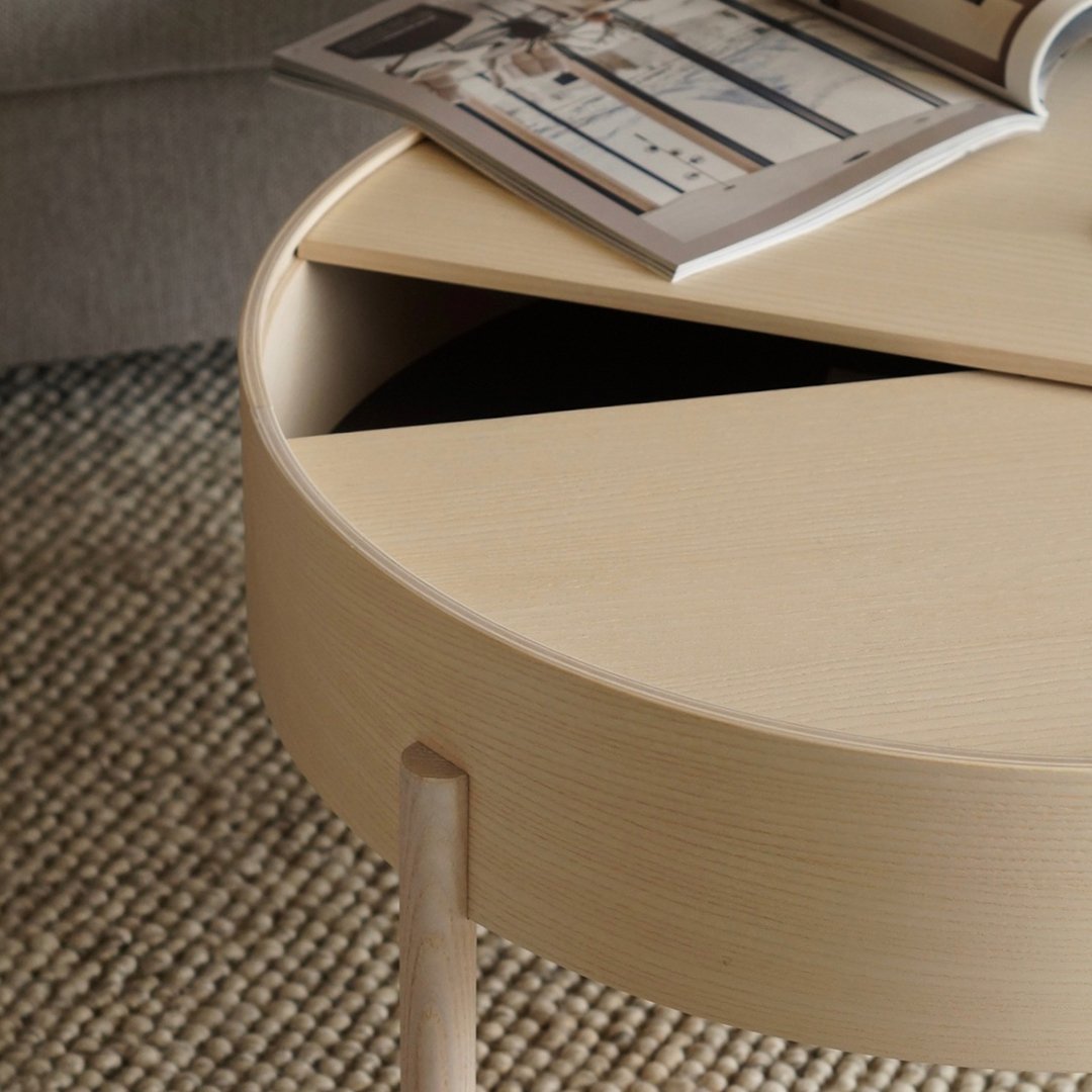 Light wood round coffee table with a geometric split design and a soft, neutral finish. Ideal for modern decor.