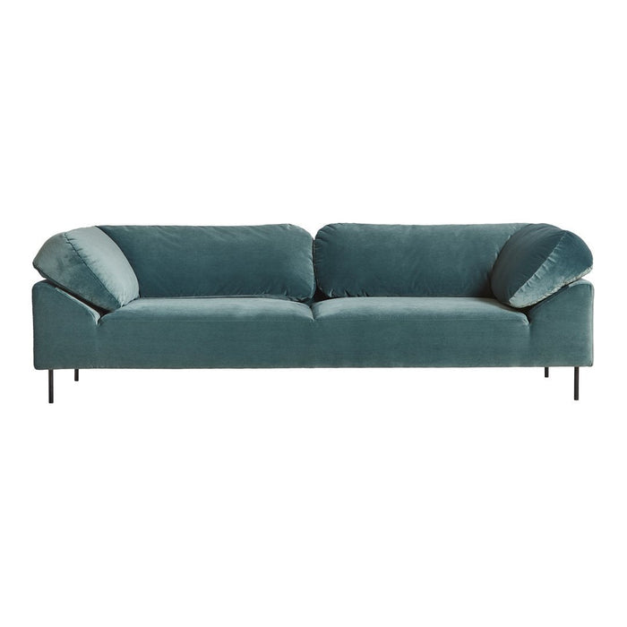 Teal velvet sofa with simple lines and plush, oversized cushions for a modern, chic look.