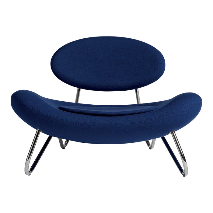 Modern navy blue lounge chair with smooth, curved shapes and sleek chrome legs, perfect for contemporary decor.