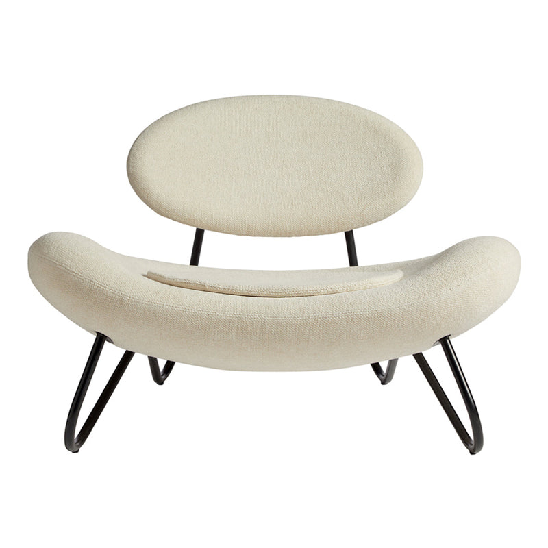 Beige minimalist chair with smooth curves and sleek black metal legs. Modern design for any decor style.