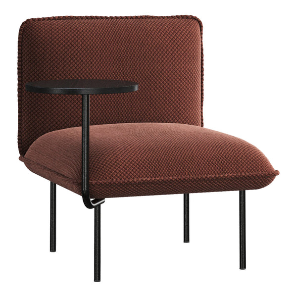 Rust-colored chair with textured upholstery and a sleek black side table, perfect for modern decor.