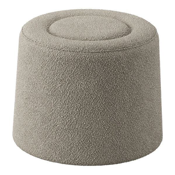 Soft beige upholstered pouf with textured surface and rounded top, perfect for modern decor.