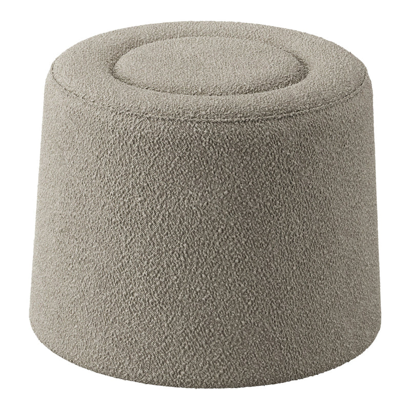 Soft beige upholstered pouf with textured surface and rounded top, perfect for modern decor.