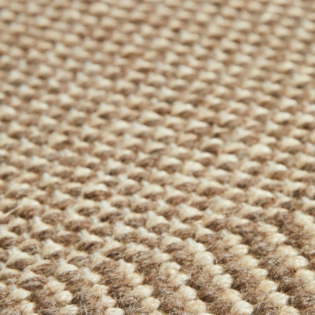 Beige and brown woven rug texture with a subtle, patterned design for a natural look.