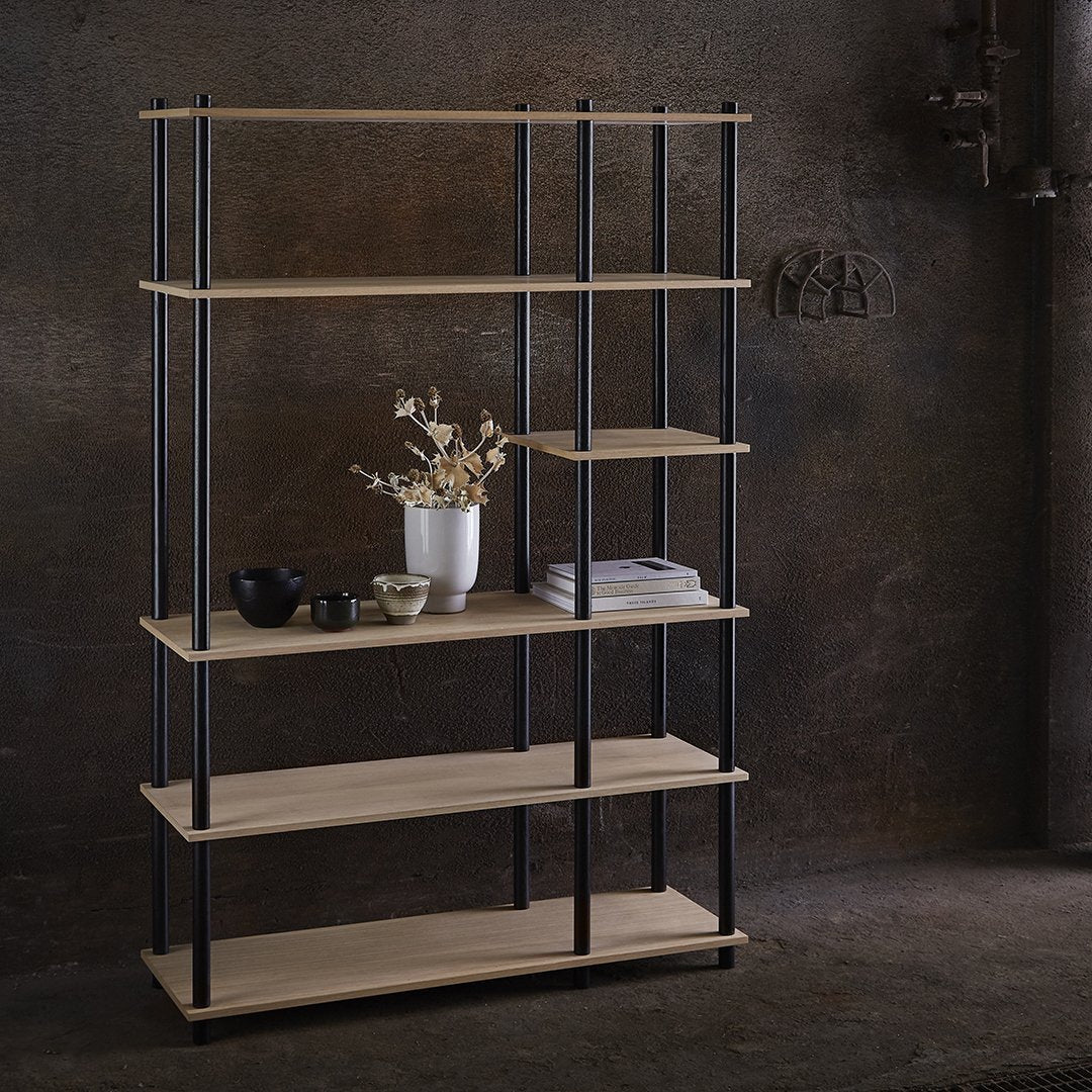 Modern black metal and natural wood bookshelf with clean lines, showcasing warm tones and minimalist design.