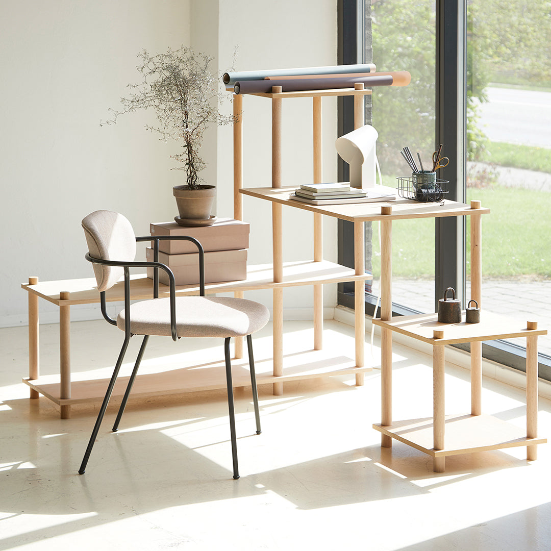 Minimalist furniture set in natural wood tones, featuring soft beige and sleek black accents, perfect for modern decor.