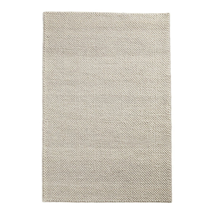 Beige woven area rug with subtle texture and a minimalist design, perfect for any modern decor.