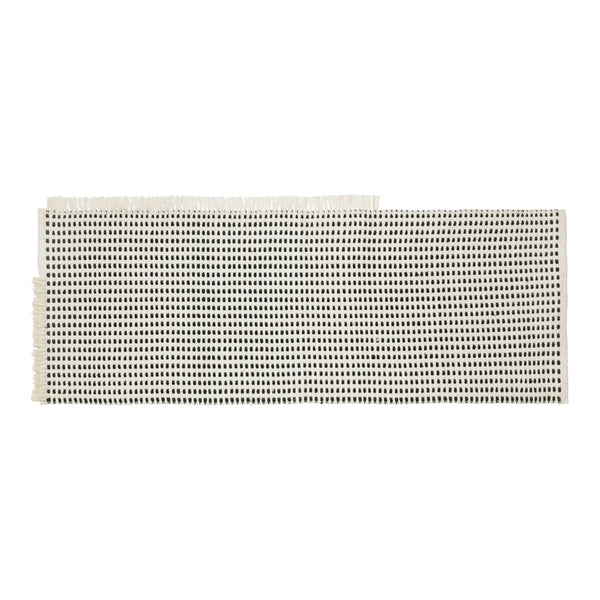 Light beige fabric with a grid pattern of small black dots, ideal for various crafting projects.