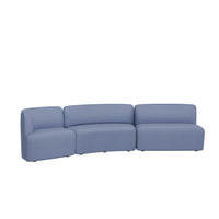 Curved blue sofa with smooth, modern design and soft texture, perfect for contemporary living spaces.