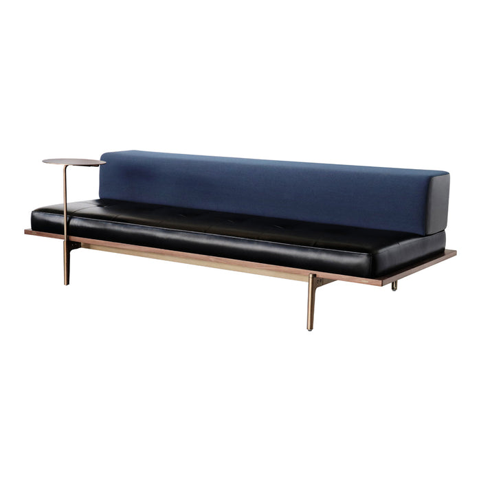 Sleek navy blue and black modern sofa with a minimalist walnut base and stylish side table attachment.