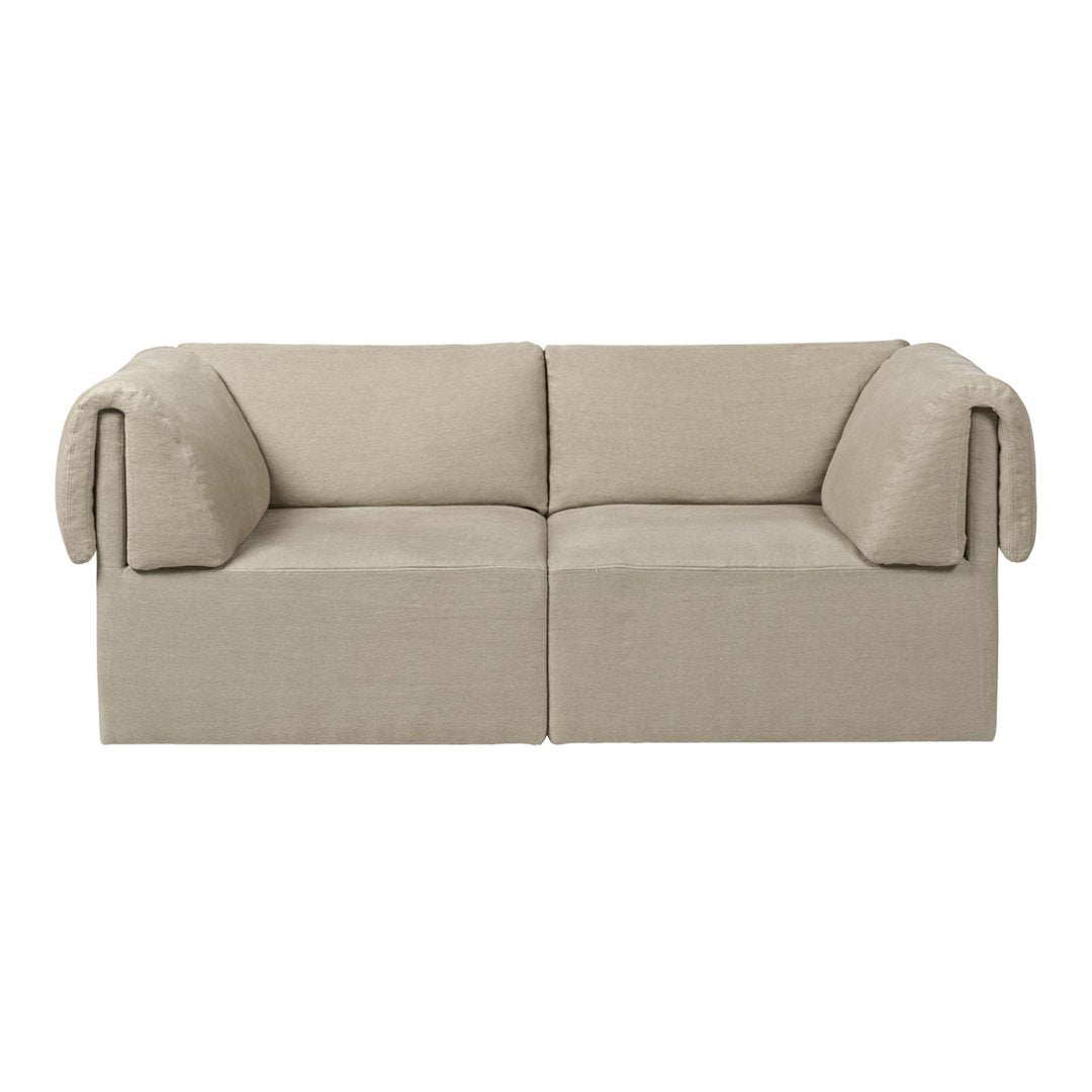 Beige upholstered sofa with minimalist design and soft, rounded armrests, perfect for modern interiors.