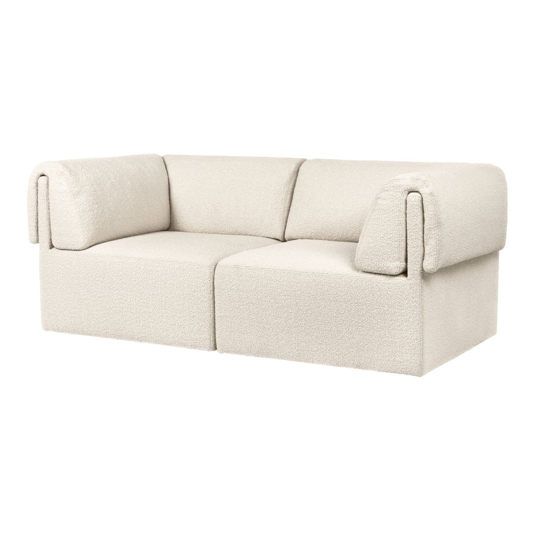 Textured cream-colored sofa with oversized arms and a minimalist design. Perfect for modern living spaces.