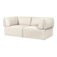 Textured cream-colored sofa with oversized arms and a minimalist design. Perfect for modern living spaces.