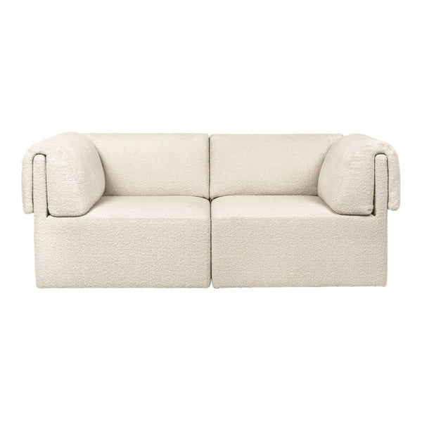 Beige two-seater sofa with a textured fabric and rounded arms, perfect for minimalist decor.