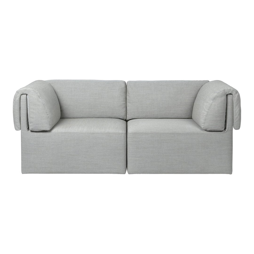 Gray minimalist sofa with soft rounded arms and smooth fabric texture, perfect for modern living spaces.