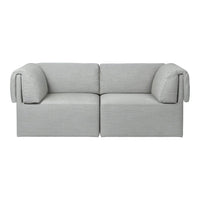 Gray minimalist sofa with soft rounded arms and smooth fabric texture, perfect for modern living spaces.