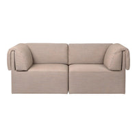 Beige modular sofa with textured fabric and soft rounded armrests, perfect for modern living spaces.