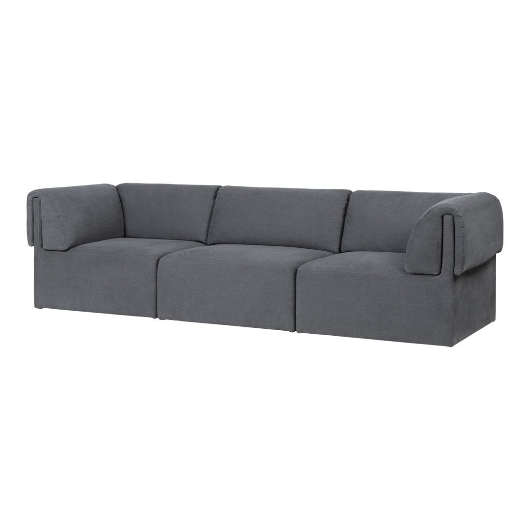 Gray upholstered couch with a sleek, modern design and smooth fabric texture. Perfect for contemporary living spaces.