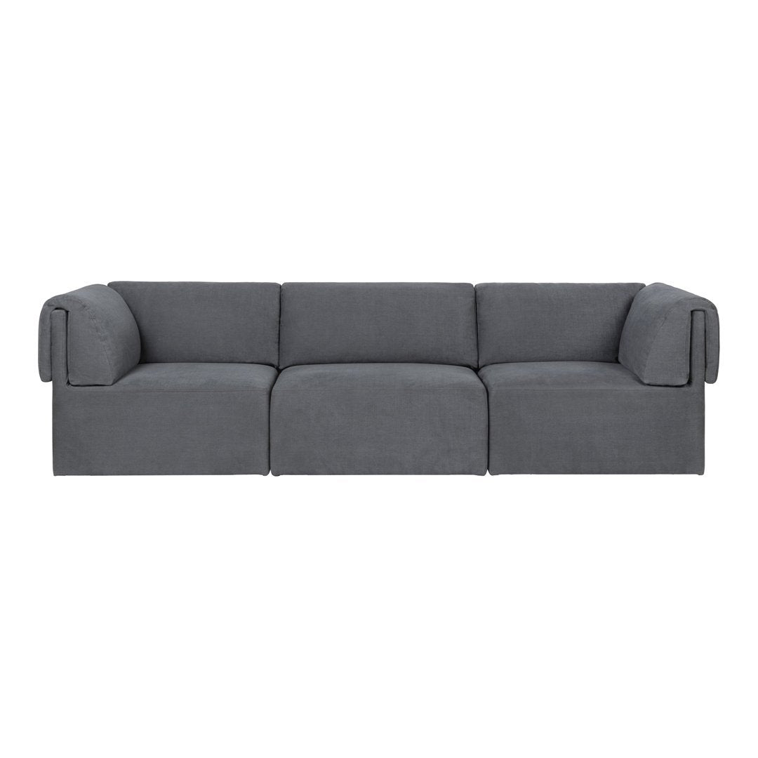 Gray sofa with a modern, minimalist design and soft, textured fabric. Perfect for contemporary living spaces.