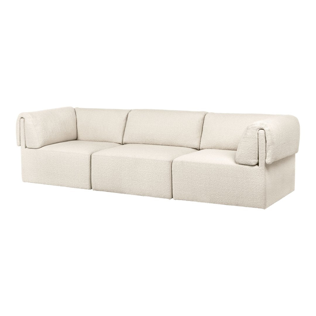 Cream-colored modular sofa with a soft textured fabric and minimalistic design.