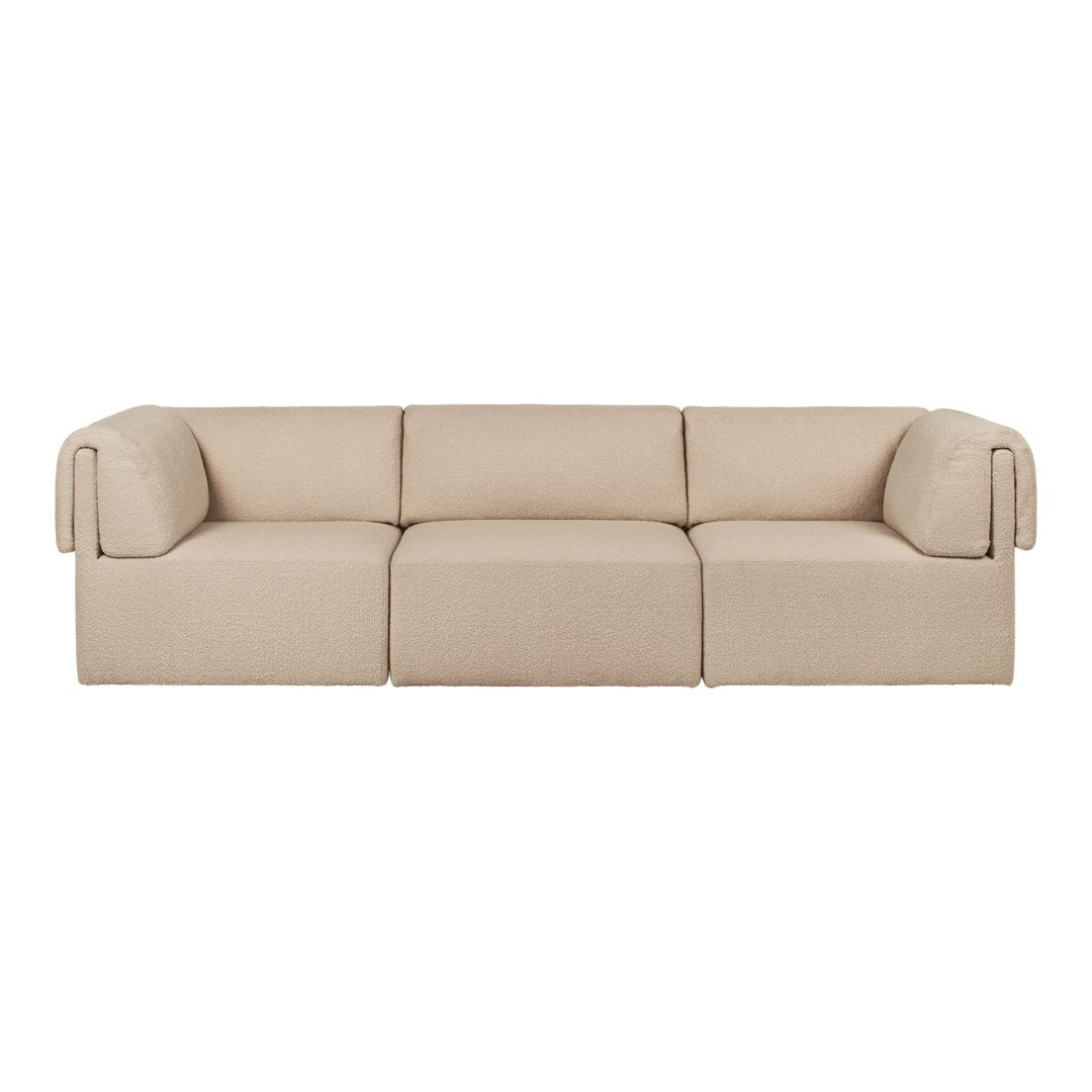 Beige modular sofa with a seamless design and soft, textured fabric. Ideal for modern living spaces.