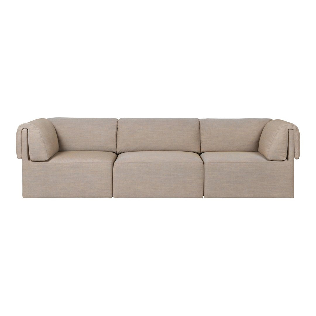 Beige sofa with a minimalist design and textured fabric, featuring smooth lines and soft curves. Perfect for modern decor.