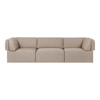 Beige sofa with a minimalist design and textured fabric, featuring smooth lines and soft curves. Perfect for modern decor.