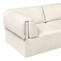 Cream textured sofa featuring a soft, plush surface with subtle patterns, perfect for modern interiors.