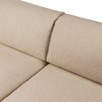 Beige textured upholstery with a soft, cozy finish, showcasing a seamless design for a modern look.