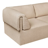 Beige textured sofa with a cozy, soft boucle fabric and minimalist design, perfect for modern interiors.