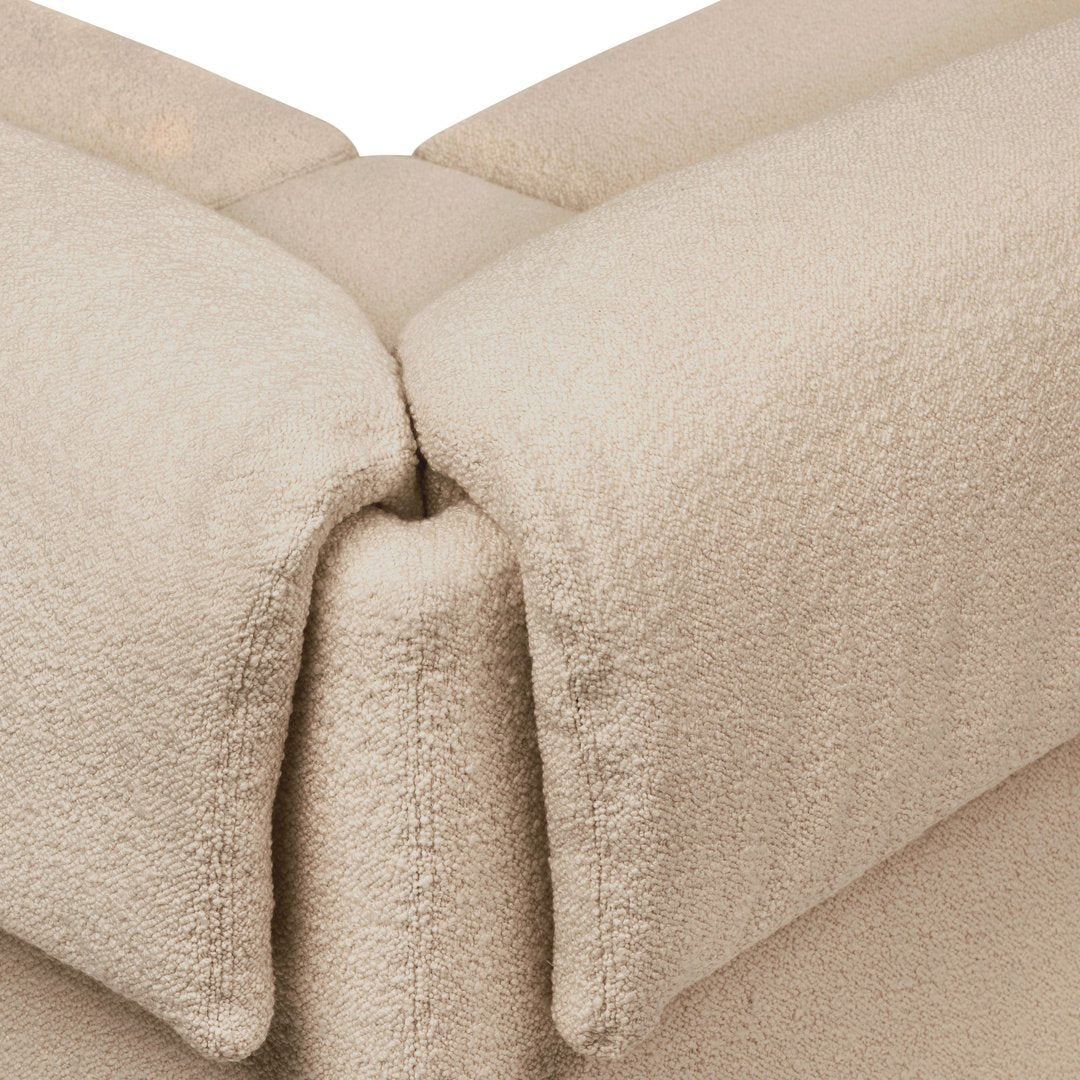 Beige plush fabric with a soft, textured pattern, featuring clean lines and a cozy appearance.