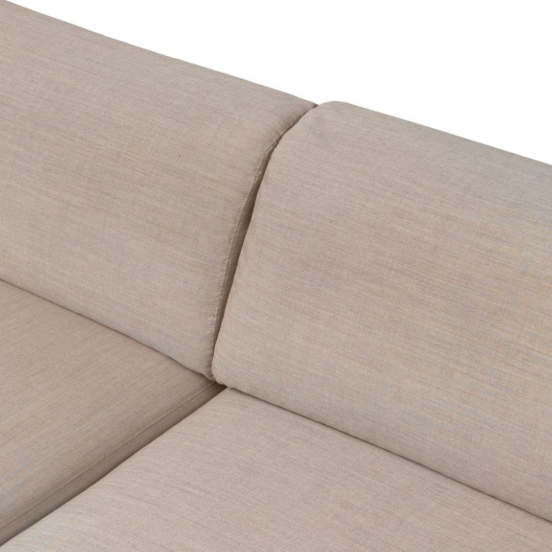Beige textured fabric with subtle patterns, perfect for contemporary home decor.