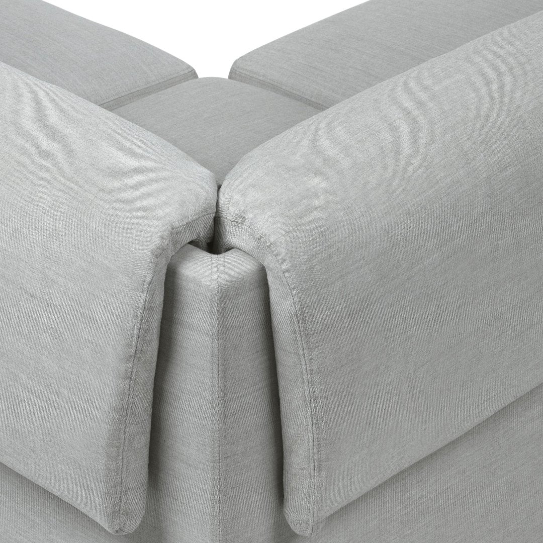 Gray textured fabric cushions with a subtle woven pattern, showcasing modern minimalism and versatility.