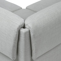 Gray textured fabric cushions with a subtle woven pattern, showcasing modern minimalism and versatility.