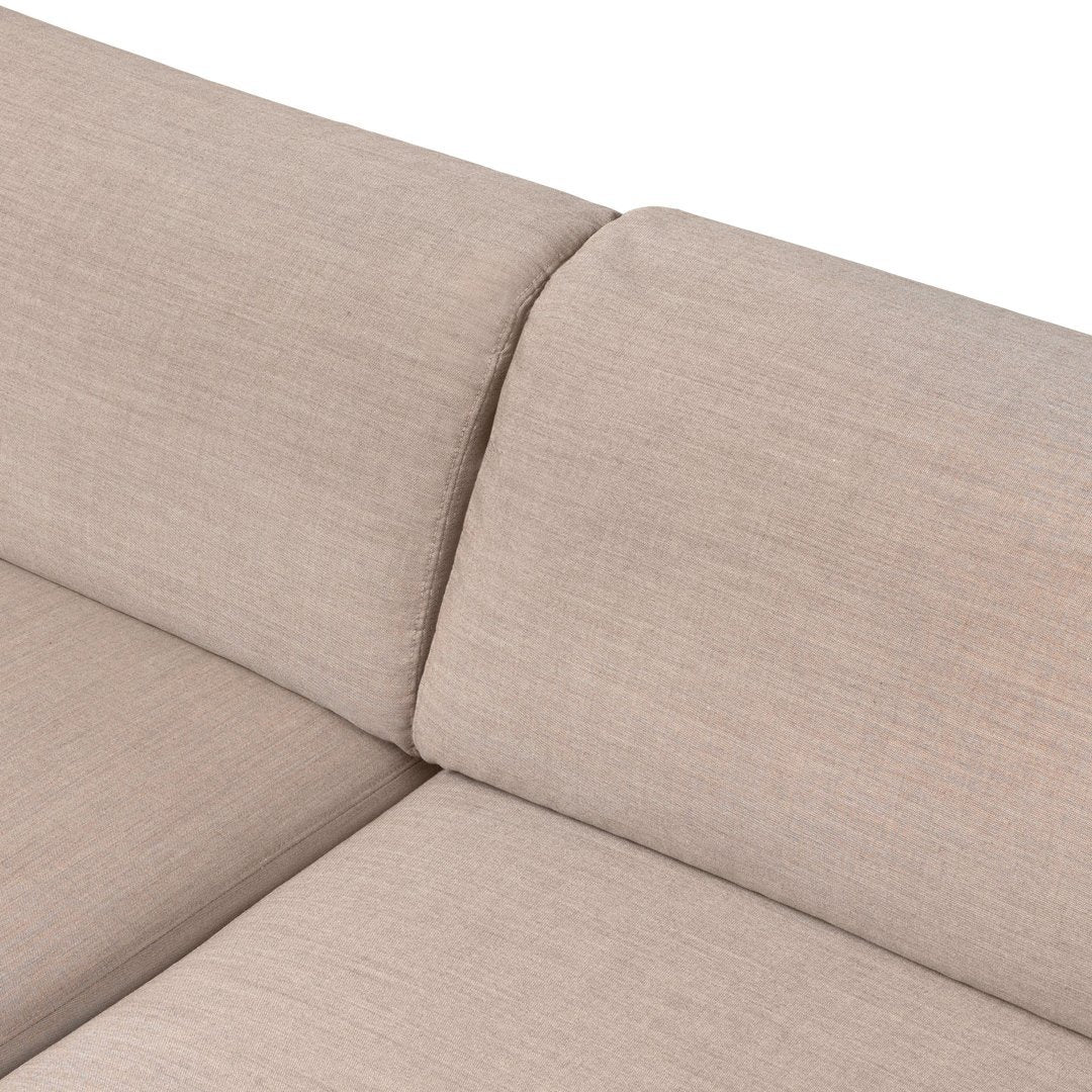 Light beige couch upholstery with a smooth, subtle texture and minimalistic design. Perfect for modern decor.