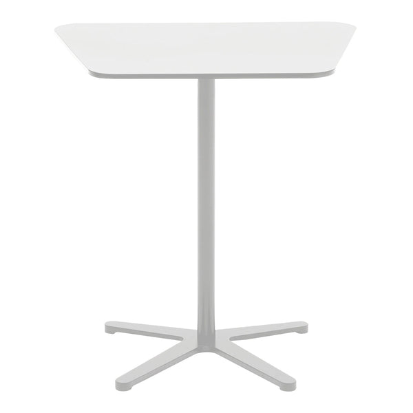 White dining table with a sleek, minimalist design and a light gray base, featuring smooth, clean lines.