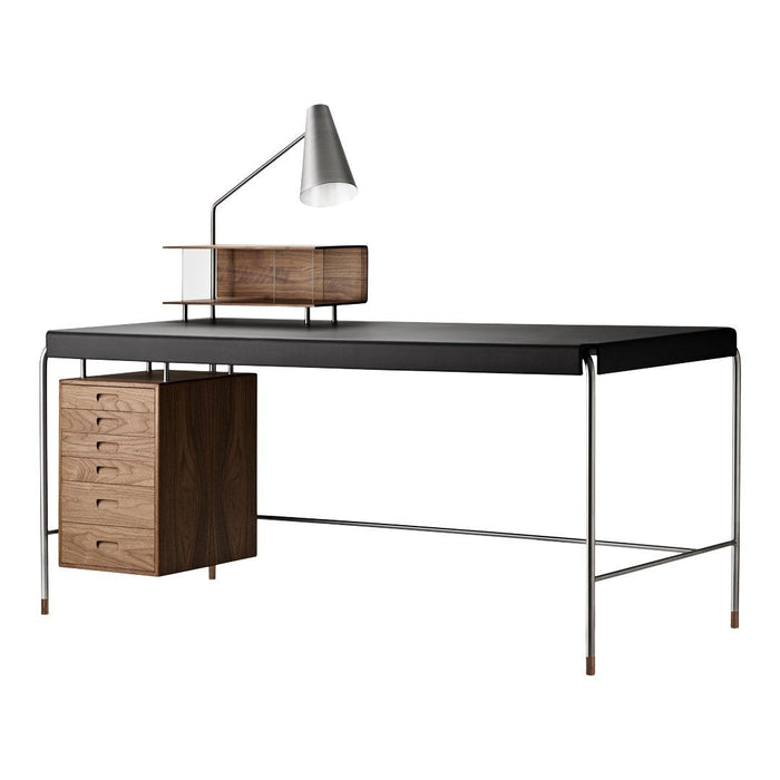 Modern black desk with wood accents, featuring a sleek design and minimalistic silver lamp. Perfect for any workspace.