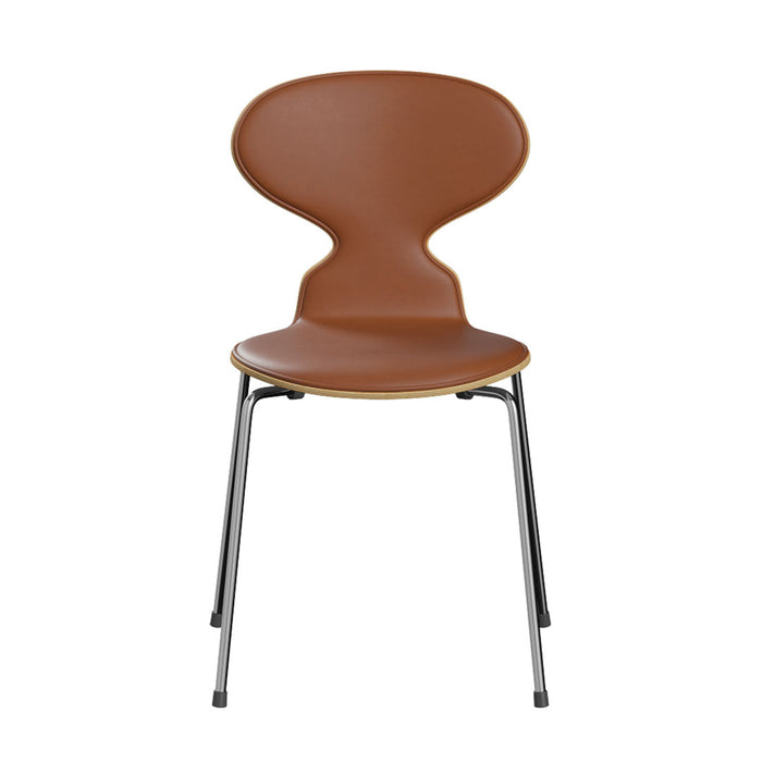 Brown curved chair with sleek metal legs. Featuring a smooth finish and minimalist design. Perfect for modern decor.