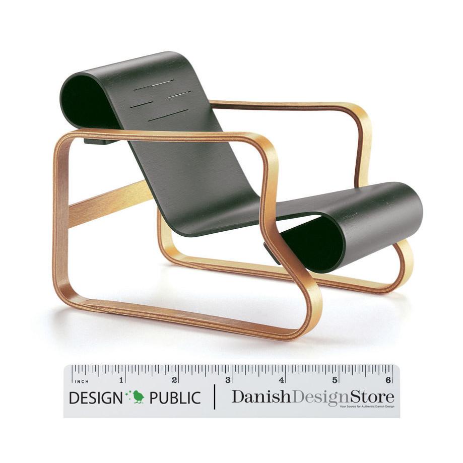 Modern green rolling chair with sleek black seat and gold frame accents, featuring a minimalist design.