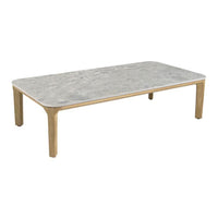 Stylish rectangular coffee table with a grey marble top and natural wooden legs. Modern design with sleek lines.