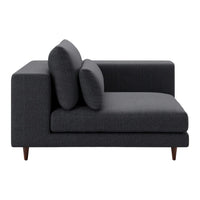 Stylish dark charcoal gray sectional sofa with smooth fabric and rounded cushions, elevate modern home decor.