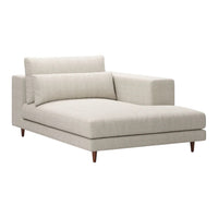 Light beige chaise lounge with a smooth texture and minimalist design, featuring solid wood legs.