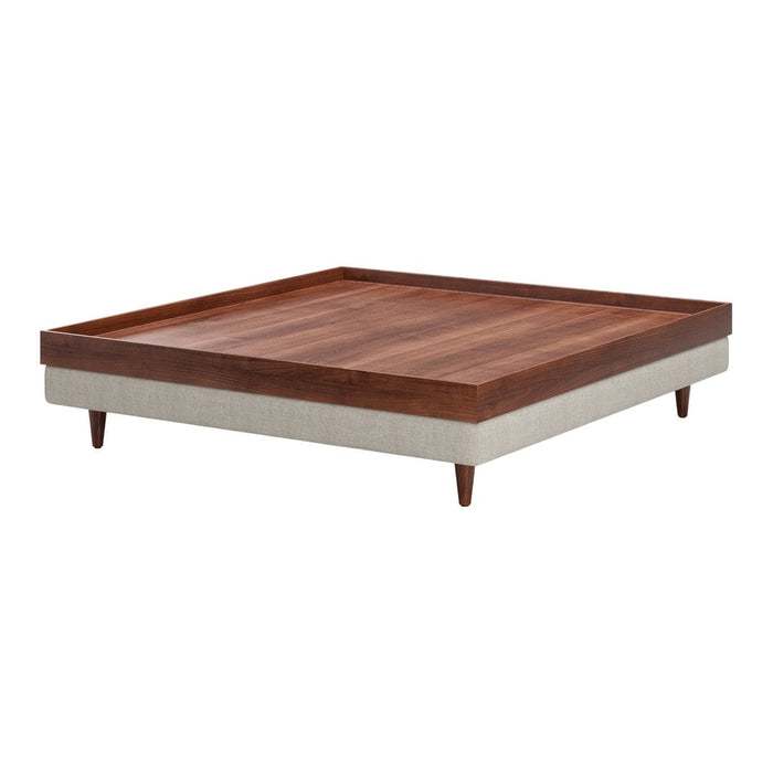Square coffee table featuring a rich walnut finish and contrasting light-colored upholstery. Elegant mid-century design.