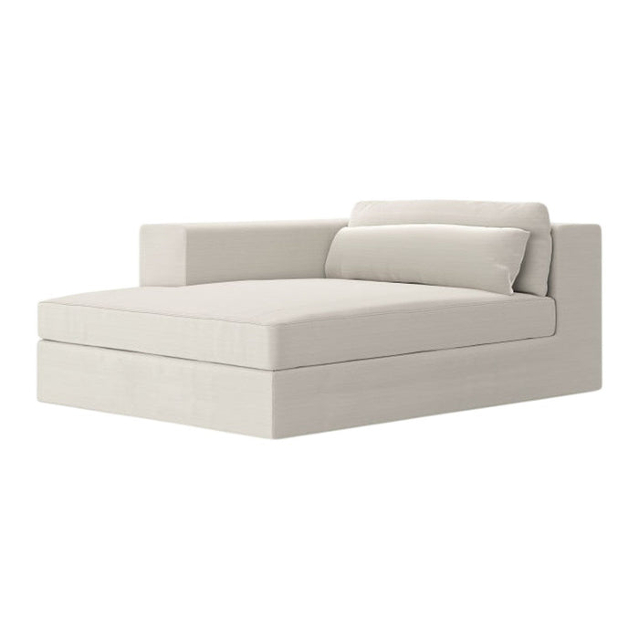 Light beige chaise lounge with a minimalist design and smooth fabric, featuring a single cushion for added comfort.