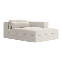 Cream-colored, minimalist sofa with a sleek, solid pattern and modern design, featuring a single side armrest.