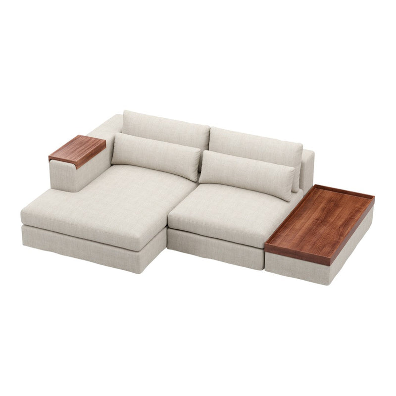 Light beige sectional sofa with soft texture, complemented by rich walnut wood accents and sleek lines.