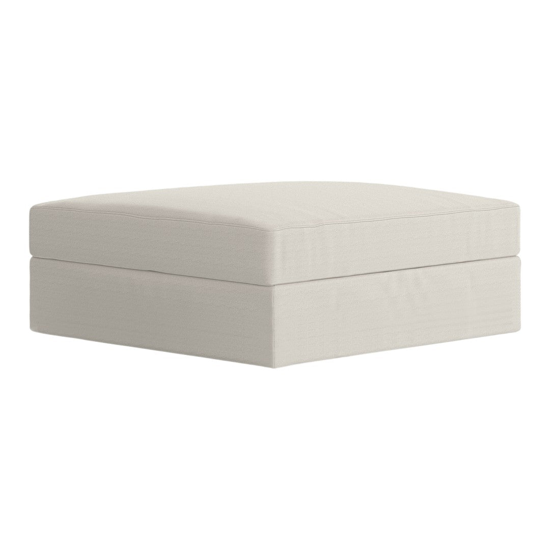 Light beige square ottoman with a smooth, minimalist design and no visible patterns. Perfect for any decor style.
