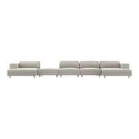 Modern sectional sofa in light gray upholstery with clean lines and subtle textured pattern. Natural wood legs.