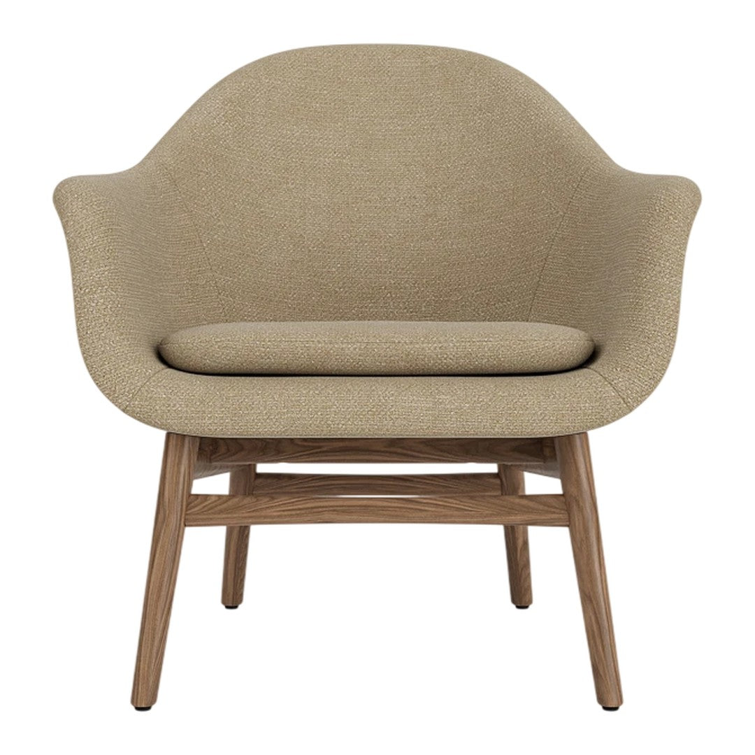 Beige upholstered chair with a smooth, rounded design and wooden legs, perfect for modern decor.