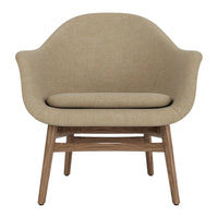 Light beige upholstered chair with a smooth, curved design and wooden legs for a modern touch.
